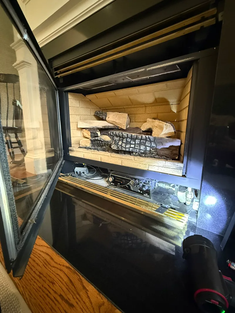 Gas fireplace burner and log set during service — gas fireplace service example by Chimney Goat