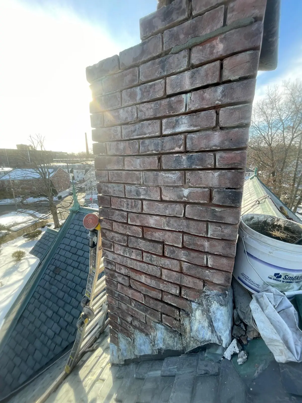 Close-up of fresh mortar joints on a repointed brick chimney