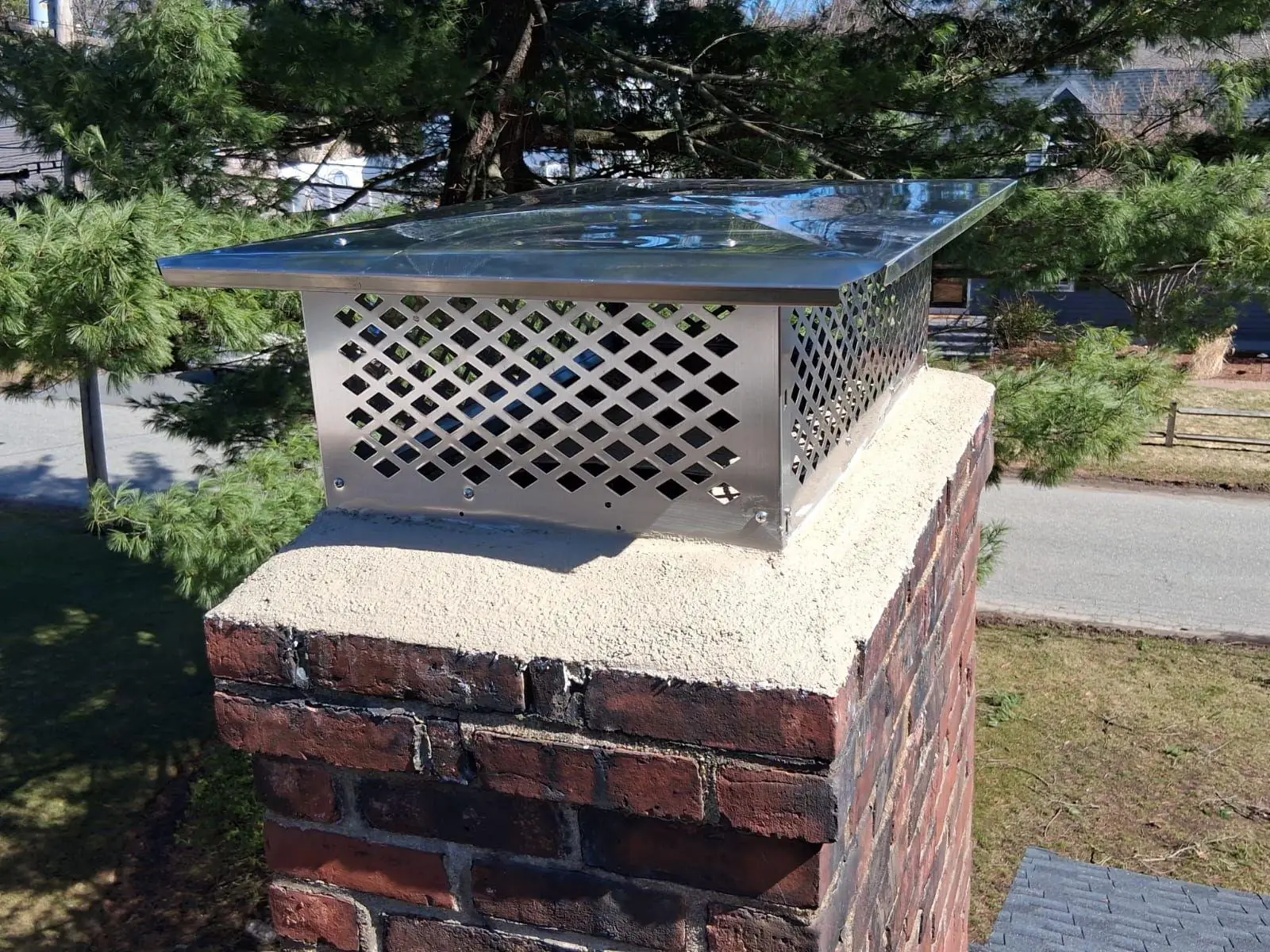 Finished chimney crown repair with a new crown and stainless cap