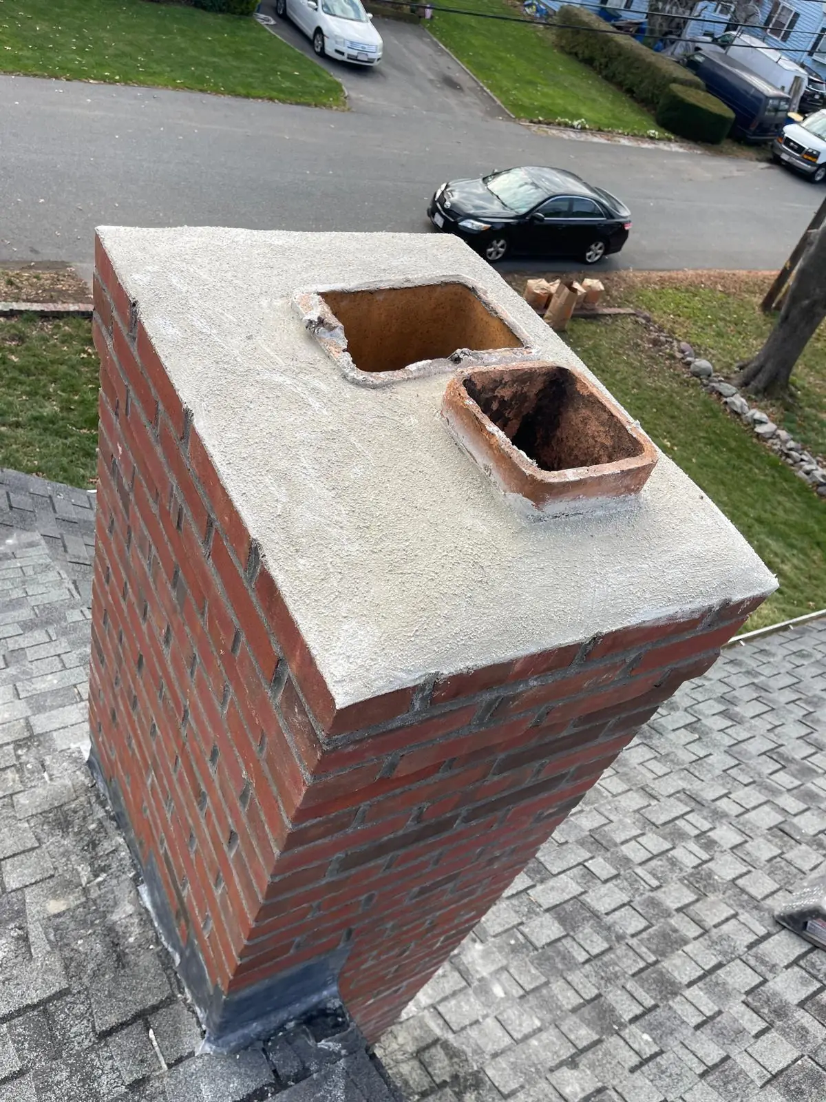 New concrete chimney crown poured over two flue tiles
