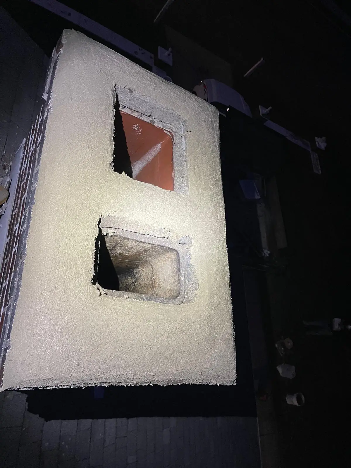 Freshly poured chimney crown sealing the chimney top