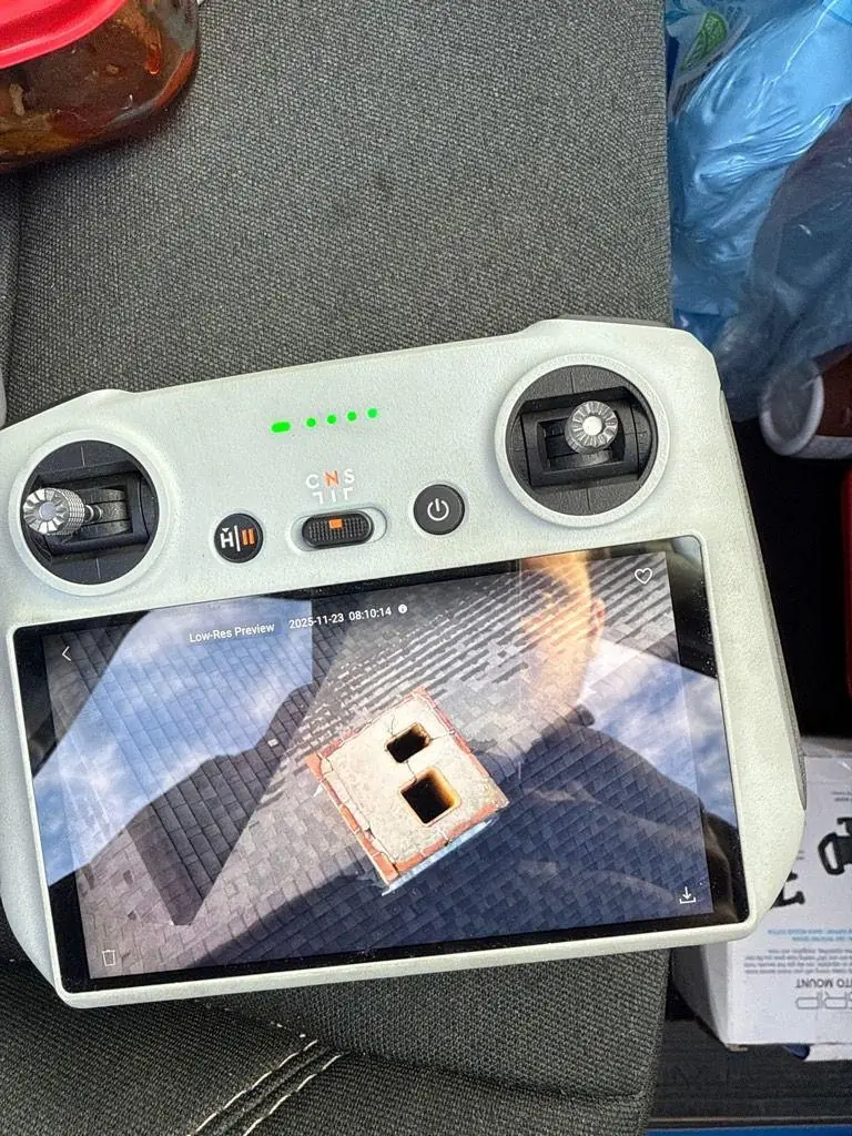 Top-down drone view of a chimney top during inspection