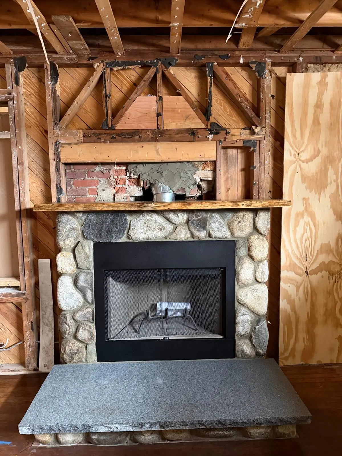 Stone fireplace firebox rebuild in progress