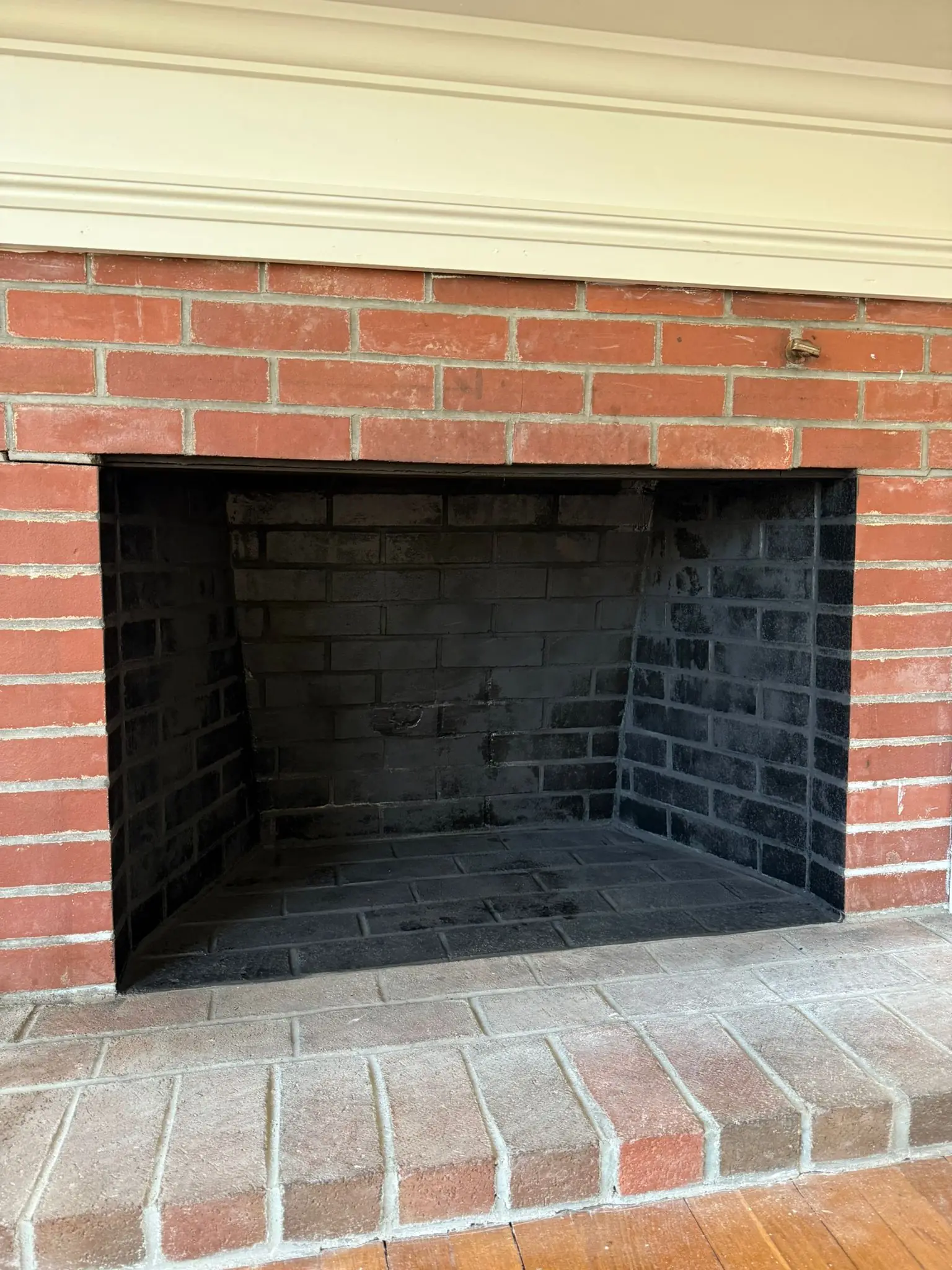 Brick fireplace prepped for rebuild with the firebox stripped