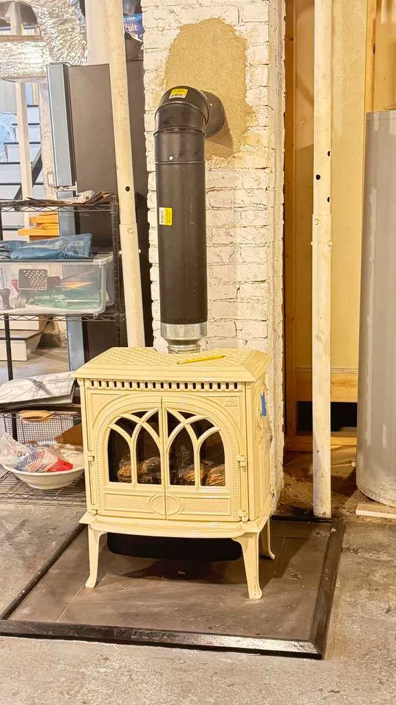 Cast-iron freestanding gas stove installation by Chimney Goat