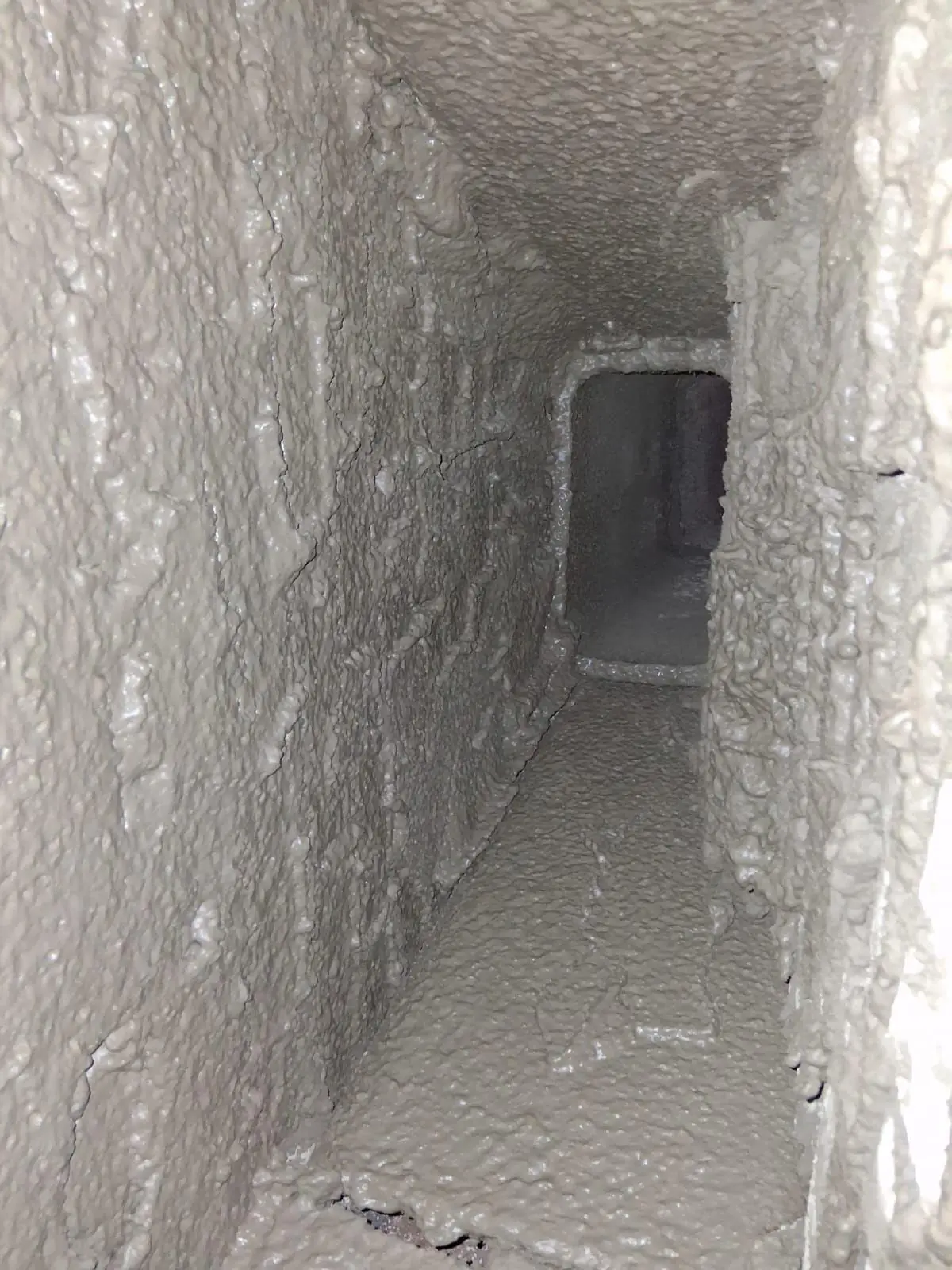 Smooth parge coat applied to a smoke chamber for better draft
